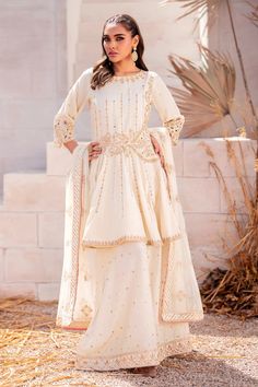 Bright White Pakistani Wedding Dress Embroidered Gharara Frock is adorned with hand-crafted details of crystals, pearls, motifs, and stones. Lavish designs and premium quality fabric make this Pakistani Wedding Dress your foremost priority for the wedding to have a head-turning look White Pakistani Wedding Dress, Wedding Dress Embroidered, Wedding Dresses Pakistani, Desi Wedding Dresses, Pakistani Wedding Outfits, Pakistani Wedding Dress, Pakistani Wedding Dresses, Embroidery Suits Design, Desi Wedding