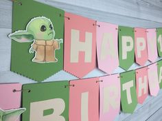 a star wars themed birthday banner with the words happy 1st birthday and baby yoda