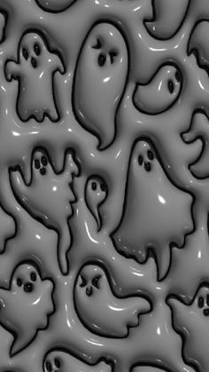 a group of ghost like objects in grey and black