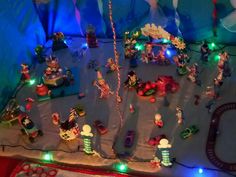 a christmas scene is shown with toys and lights