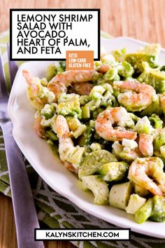 a white plate topped with shrimp and broccoli