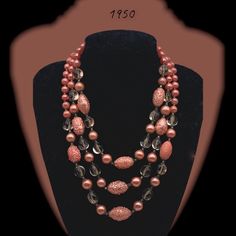 A majestic necklace for the woman with passion for Pink fashion.  This magnificent deep Pink cascaded necklace marries  pink shiny beads  with assymetrical oval transparent powder pink beads, lovely oval sugared pink beads, and miniature transparent spaces beads create this jewelry that you will enjoy wearing anywhere, anytime. The bead sizes range from 9 to 25 millimeters. The necklace is 46 - 53 - 60 centimeters (17 3/8 - 18 inches) long and closes with a box-clasp that feature flower shape in Cascade Necklace, Sugar Beads, Mode Rose, Bead Sizes, Pearl Necklace Vintage, Unique Brooch, Necklace Art, Multi Layer Necklace, Box Clasp