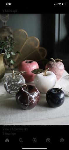 a table topped with lots of different types of vases