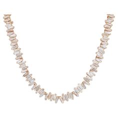 Elegant and alluring, this diamond tennis statement necklace features prong set Baguette Cut shimmering white diamonds weighing 13.10 carats in total. Diamond quality: G-H color and VS-SI clarity. Crafted in fine 18k yellow gold. The necklace is secured by a hinged locking clasp. Length: 16 inches. Width: 5 mm. Total diamonds: 235. Total weight: 27.54 grams. Comes with a presentable gift box and appraisal. Luxury Refined Baguette Cut Jewelry, Luxury Diamond Necklace With Baguette Diamonds, Luxury Baguette Diamond Necklace For Formal Events, Elegant Luxury Necklace With Baguette Diamonds, Luxury Baguette Diamond Necklace, Luxury Modern Baguette Cut Necklace, Luxury Fine Jewelry Tennis Necklace With Baguette Diamonds, Luxury Baguette Cut Necklace Gift, Luxury Baguette Cut Tennis Necklace