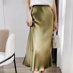 This satin midi skirt is a must-have. Designed with timeless style in mind, the high waist A-line silhouette gives a flattering finish. The hidden zip closure means you can get in and out of the skirt very easily. For a casual look, style with a t-shirt and trainers and to dress it up add a pair with heels. High waisted A-Line Silhouette Hidden zip closure Midi Length Unlined 100% Polyester Satin Skirt Outfit, Summer Korean Fashion, Silk Skirts, A Line Midi Skirt, Hacks Clothes, Heels High, Purple Skirt, Satin Midi Skirt, Satin Blouses