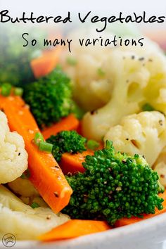 a bowl filled with cauliflower, carrots and broccoli on top of a table