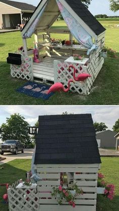 a small house made out of pallets with flowers on the roof and in the yard