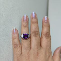 Beautiful 3.61 ct. amethyst oval and 0.41 ct. good quality white diamond rounds.  Handmade in platinum.  Ring size 7.  Metal:Platinum Stone: Amethyst,White Diamond Stone Cut: Oval Cut  Dimensions reference the ring size and are not specific to the ring itself. Exact ring dimensions are not provided. Please reach in the seller Q&A for questions. Luxury Oval Amethyst Platinum Ring, Oval Brilliant Cut Amethyst Ring In Fine Jewelry Style, Oval Brilliant Cut Amethyst Ring Fine Jewelry, Oval Brilliant Cut Amethyst Ring, Oval Amethyst Ring With Diamond Accents For Anniversary, Luxury Oval Amethyst Diamond Ring, Purple Oval Diamond Ring With Accent Stones, Oval Purple Diamond Gemstones, Anniversary Oval Amethyst Ring With Diamond Accents