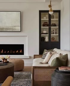 a living room filled with furniture and a fire place