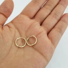 "These hoops are crafted in 18K gold and make a great \"every-day\" earring because they compliment any outfit, it is available in 11mm, 13mm, 15mm and 19mm. Style: Plain hoop earring Hoop Size: (Select from option) Hoop Width: approx. 2mm and 3mm (Select from option) Metal: 18 Karat Yellow Gold Country of Origin: United states Finished: High quality Sold by Pair We do carry other style, Please contact us for more information.  Please Check My Etsy Store for More Items and Great Price   ♥ ♥ ♥ ♥ 14k Gold Nickel-free Huggie Earrings, 14k Gold Filled Yellow Gold Hoop Cartilage Earrings, 14k Gold Filled Yellow Gold Cartilage Hoop Earrings, Nickel-free Yellow Gold Huggie Earrings, Hypoallergenic Small Hoop Huggie Earrings In 14k Gold, Hypoallergenic 14k Gold Small Hoop Huggie Earrings, 14k Gold Huggie Cartilage Earrings With Ear Wire, 14k Gold Huggie Earrings With Lever Back, Nickel-free 14k Gold Huggie Hoop Earrings