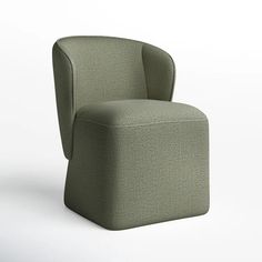 a green chair sitting on top of a white floor