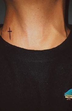 a man with a cross tattoo on his neck