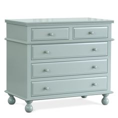 a white dresser with four drawers on wheels