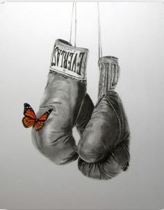 a drawing of two boxing gloves hanging from strings with a butterfly on the top one