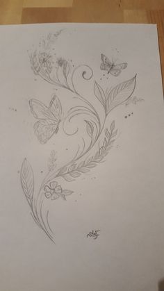 a sheet of paper with some drawings on it and butterflies flying over the top of it