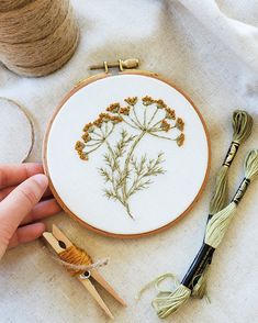 someone is working on an embroidery project