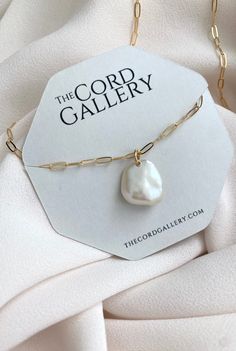 Add a fun twist to the pearl necklace with these stunning minimalist pieces. Features a genuine, Freshwater Pearl that is adorned on your choice of chain. Each pearl will be similar but totally unique as they are all natural. Chain Style Options:Gold Filled Link ChainGold Filled Box ChainGold Filled Figaro ChainGold Filled Rectangle ChainLength Options:16 inches18 inches 20 inches22 inches24 inches Modern Pearl Drop Pendant Necklace, Modern White Necklaces With Pearl Charm, Modern Pearl Necklaces For Gift, Modern Pearl Necklaces As A Gift, Everyday Pearl White Jewelry With Pearl Pendant, Pearl White Necklace As A Gift, Modern White Necklace With Pearl Charm, Modern Pearl Necklace With Pearl Pendant, Pearl White Jewelry With Pearl Pendant For Everyday