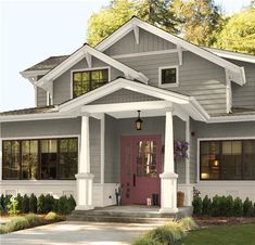 the front view of a house with white trim