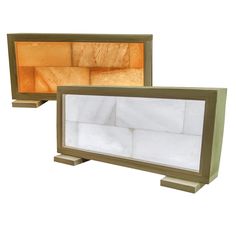 two wooden boxes with white sheets in them