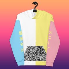 "The Color Block trend is in, and you don't want to miss out. This one of a kind hoodie features blocky pastels and Japanese on either sleeve, which read \"Dream\" and \"Ikigai\".  Ikigai (生き甲斐, 'a reason for being') is a Japanese concept referring to something that gives a person a sense of purpose, a reason for living. The REACTION color block line nods back to fun 80's and 90's designs, but with a modern twist. You won't find this design in a brick and mortar store, trust me. -------------------------------------------------- * 70% polyester, 27% cotton, 3% elastane * Fabric weight: 8.85 oz/yd² (300 g/m²) * Super soft cotton-feel fabric face * Brushed fleece fabric inside * Double-lined hood with design on both sides * Unisex style * Comes with drawstrings * Overlock seams * See size ch Kawaii Hoodie For Spring Streetwear, White Kawaii Hoodie With Letter Print, Kawaii White Hoodie For Spring, Harajuku Style Pink Hoodie With Graphic Print, White Kawaii Hoodie For Streetwear, Spring Color Block Sweatshirt For Streetwear, Spring Streetwear Color Block Sweatshirt, Trendy White Patchwork Sweatshirt, White Kawaii Sweatshirt For Streetwear