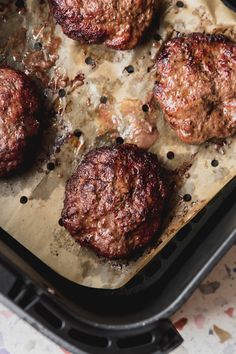 These air fryer burgers are the juiciest and easiest burgers you'll ever have! They're made from scratch but still take less than 15 minutes to make.