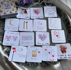 playing cards are arranged on a tray with beads and other things to do in the background