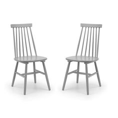 two wooden chairs side by side on a white background