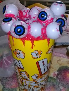 a vase filled with lots of fake eyeballs