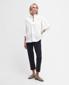 Kelburn High Neck Blouse If you're looking for an alternative to your trusty T-shirts this summer, the Barbour Kelburn High-Neck Blouse is the perfect choice. Boasting a relaxed smock silhouette, it's complete with ruffled detailing to the collar and neckline with self-ties to finish. Casual Cotton V-neck Blouse, Relaxed Fit Split Neck Top For Day Out, Cotton V-neck Blouse For Casual Gatherings, Relaxed V-neck Cotton Blouse, Relaxed V-neck Daywear Top, Relaxed V-neck Top For Daywear, Cotton Split Neck Tops For Daywear, High Neck Blouse, Fabric Tape