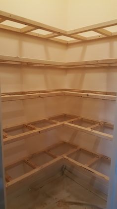 an unfinished shelving unit is shown in the process of being built