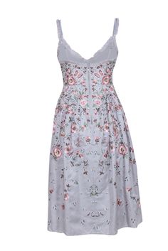 Take your style to new heights with this dreamy, fairytale-esque midi dress from Needle & Thread. The stunning floral and butterfly embroidery pops against a light blue backdrop, while precious pleats and a voluminous skirt add a whimsical touch. Complete the look with pink satin heels for a truly lovely ensemble. Size 6 Shell 100% Tencel Lining 100% Polyester Trim 100% Nylon Exposed back zipper Adjustable straps Ruffled v-neckline, accentuated waist and a Voluminous midi skirt Intricate floral embroideries Softly pleated from the waist Bust 33" Waist 29" Shoulder to hem 46" Light Blue Floral Applique Summer Dress, Blue Floral Embellished Midi Dress, Feminine Blue Dresses With Floral Embroidery, Light Blue Midi Dress With Floral Embroidery, Light Blue Summer Dresses With Floral Embroidery, Light Blue Floral Embroidered Summer Dresses, Summer Light Blue Dress With Floral Embroidery, Light Blue Floral Embroidery Dress For Summer, Light Blue Floral Embroidered Dress For Summer