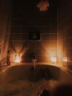 a bathtub with lights shining in the dark