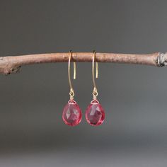 "Stunning faceted Hot Pink Quartz teardrops are wire wrapped with 14k gold filled wire on to 14k gold vermeil long earwires.  Wonderful lightweight statement earrings to wear anytime in the most beautiful bright color!   Pink Quartz teardrops: 10x13mm Total length of earrings: 1 1/2\" As the owner, maker, designer, and curator of this shop, I take great pride in providing you with jewelry that you will love to wear everyday, for special occasions, and for many years to come.  Please read my Shop Pink Wire Wrapped Teardrop Earrings, Pink Drop Earrings With Ear Wire, Faceted Teardrop Dangle Earrings As Gift, Faceted Teardrop Dangle Earrings For Gift, Pink Faceted Drop Earrings, Gift Teardrop Dangle Earrings With Faceted Details, Faceted Briolette Teardrop Earrings, Wire Wrapped Teardrop Drop Earrings, Teardrop French Hook Earrings As Gift