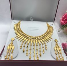 Handmade Indian Bridal Wedding Jewelry 22ct Heavy Gold Plated Necklace Set with Earrings Indian Jewelry Indian Bollywood Jewelry , its Artificial Jewelry  Type :22ct Gold Plated Necklace Set Earrings Length: 3"inches Approx Shape - As Shown in Picture It is a perfect match with formal attire on special occasions or with casual wearing Not Comes in Jewellery Gift Box Traditional Indian Wedding Jewellery Slight Colour variations possible due to difference in screen and photograph Care instructions Heavy Gold Jewelry Sets For Formal Occasions, Ceremonial Gold Hand Set Jewelry Sets, Gold Diamond Cut Jewelry Sets As Gift, Gold Diamond Cut Jewelry Sets For Gifts, Ceremonial Hand Set Gold Bridal Sets, Gold Jewelry Sets Diamond Cut Gift, Hand Set Gold Bridal Sets For Ceremonial Occasions, Gold Diamond Cut Jewelry Sets For Wedding, Ceremonial Gold Bridal Sets With Hand Set