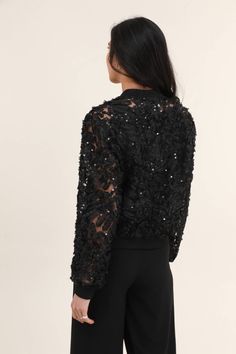 Lace bomber jacket featuring long sleeves and front zipper. Accented with small shiny sequins. Can be worn with a cute top and jeans for a casual chic look. A great lace bomber jacket for the modern cowgirl.