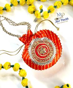 "Looking for that perfect ethnic chic look? Our handmade Leheriya Potli Bags or sling bags are just what you need! These beautiful bags can be paired with both ethnic and western outfits, making them a versatile accessory for any occasion. Trust us, these Leheriya Potli Bags are bound to steal everyone's heart! PRODUCT DESCRIPTION: ✅ SIZE : 7\"W x 8\"H  Long Bead Strap. 7\"  ✅ COLORS: Comes in Assorted Colors! All Colors are available as shown in pictures. ✅ MATERIAL: Silk Rajasthani Leheriya wi Multicolor Potli Bag For Wedding And Navratri, Bohemian Multicolor Potli Bag For Diwali, Red Bags With Zari Work For Diwali, Festive Handmade Multicolor Pouch, Festive Red Zari Work Potli Bag, Red Festive Potli Bag, Red Rectangular Potli Bag For Festivals, Bollywood Style Multicolor Potli Bag For Diwali, Multicolor Zari Work Potli Bag For Diwali