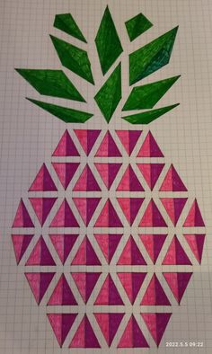 a piece of paper cut out to look like a pineapple with green leaves on top