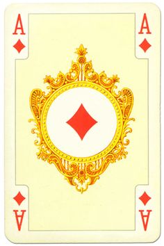 a playing card with gold and red designs