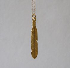 *Feather 37mm (1.5") x 7mm (18k gold plated over sterling silver)*Chain measures 15 1/2 inches (brass gold plating) Gold Feather Necklace Perfect For Gifting, Gold Feather Necklace For Gift, Gold Necklace With Feathers As A Gift, Gold Necklace With Feathers For Gift, Feather Necklace, Feather Necklaces, Brass Gold, Sterling Silver Chain, Gold Plating