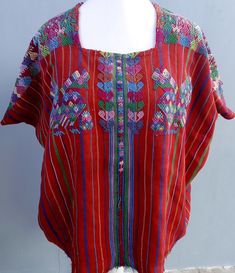 Vintage Guatemalan unique handmade weaved Red cotton Santo Domingo Xenacoj huipíl. Huipil in good condition. You will receive ready to wear as a blouse. Let us know any adjustment needed. W29" x H21" Check our complete list of available huipils: https://mayanft.com/shop/gallery/santiago-atitlan https://mayanft.com/shop/gallery Hand wash with cold water carefully. One photo and tracking code will send when be shipped. Wanna check other huipils from Xenacoj? https://t.ly/ORPje -------------------- Bohemian Red Blouse With Traditional Patterns, Red Bohemian Blouse With Traditional Patterns, Red Folk Style Top For Festival, Traditional Red Tops For Festival, Bohemian Multicolor Handloom Blouse, Traditional Red Beach Blouse, Red Folk Blouse For Festivals, Folk Style Red Blouse For Festivals, Traditional Red Blouse For Beach