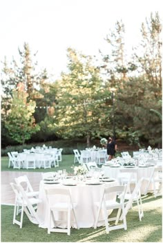 a table set up for an outdoor wedding reception