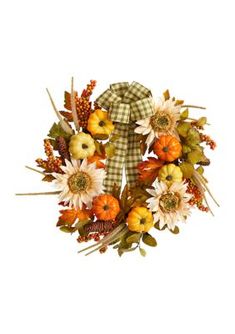 a wreath with pumpkins and flowers on it