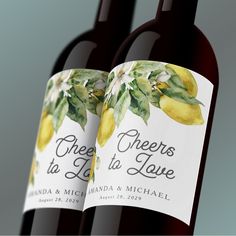 two bottles of wine with lemons and leaves on the label are shown in front of each other