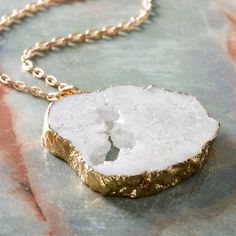 "Purchase the Signature Color Shop White Druzy Quartz Pendant By Bead Landing™ at Michaels. com. Lend an exquisite touch to your favorite necklace with this white quartz pendant by Bead Landing. Lend an exquisite touch to your favorite necklace with this white quartz pendant by Bead Landing. You can also use this druzy quartz pendant as a fancy charm for a DIY bracelet, anklet and more. Details: White 2.56\" x 1.81\" 1 pendant Quartz and copper | Signature Color Shop White Druzy Quartz Pendant B Nickel-free White Nature-inspired Jewelry, White Nature-inspired Necklaces For Healing, Nature-inspired Nickel-free White Jewelry, Nature-inspired White Jewelry With Natural Stones, Nature-inspired White Beaded Jewelry, White Pendant Jewelry For Crafting, Nature-inspired White Necklaces For Healing, White Necklace With Large Stone For Gift, White Spiritual Jewelry With Large Pendant