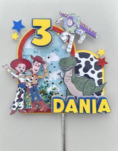 a cake topper with the characters of toy story 3 on it's side