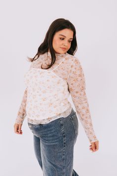 Get ready to rock this season with our PLUS SIZE Bloom All Day Top! With a trendy turtle neck and floral printed lace mesh, this top is perfect for any occasion. Available in 2 colors, you'll bloom all day and turn heads all night! Details Turtle neck Floral printed lace mesh Sizing Approximate measurements: SIZE LENGTH BUST 1XL 27" 45" 2XL 28" 46" 3XL 28" 48" Fabric has stretchModel is 5'6" wearing size 1XL Material 95% Polyester 5% SpandexHand wash coldHang to dry Floral Printed, 2 Colours, Turtle Neck, Floral Prints, Mesh, Plus Size, Turn Ons, Lace, Floral