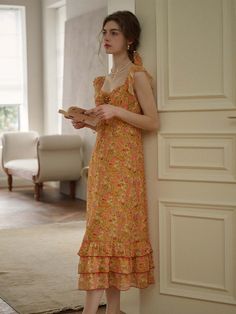 Color: OrangeStyle: BohoPattern Type: Floral, All Over PrintDetails: Tiered Layer, Ruffle Hem, KnotNeckline: SweetheartSleeve Length: SleevelessType: A LineWaist Line: High WaistHem Shaped: Layered/Tiered, FlounceLength: LongFit Type: Regular FitFabric: Non-StretchMaterial: PolyesterComposition: 100% PolyesterCare Instructions: Machine wash or professional dry cleanBody: YesSheer: NoLining: 100% Polyester Orange Ruffled Midi Sundress, Orange Ruffled Sundress Maxi Dress, Flowy Orange Floral Print Midi Dress, Orange Ruffled Midi Dress For Vacation, Orange Ruffled Dress For Garden Party, Fitted Orange Floral Dress For Summer, Orange Summer Midi Dress With Ruffles, Summer Floral Print Peach Midi Dress, Summer Orange Midi Dress With Floral Print