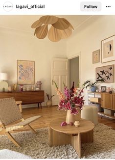 a living room filled with furniture and flowers