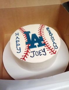 a birthday cake in the shape of a baseball