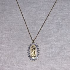 This Elegant Gold-Colored Chain Necklace Features A Delicate Oval Pendant Of Virgin Mary Surrounded By Sparkling Rhinestones. Symbolizing Safety, Love, Healing, And Protection. Great For Layering With Other Necklaces For A Truly Unique Look. Nwot. From Both A Pet Free & Smoke Free Home. Measurements Included In Listing Pictures. Catholic Jewelry Scaperal, Clock Necklace, Taurus Necklace, Virgin Mary Pendant, Sparkle Necklace, Layered Necklace Set, Heart Choker, Statement Choker Necklace, Crystal Choker